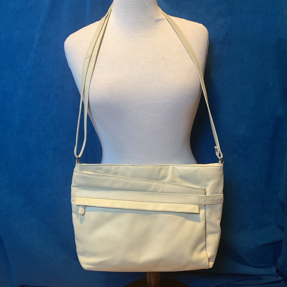 Derek Alexander leather cream purse. Great condition Long adjustable strap